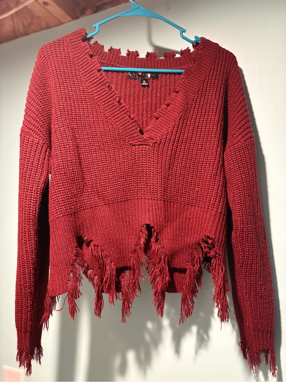 Buckle Distressed V-Neck Sweater in Deep Red